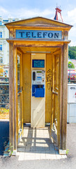 Picture of isolated old call box in the historic Czech city of Carlsbad during daytime