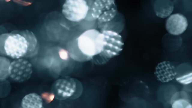 Big bokeh background. Grey or metallic defocused circular facula. Natural Floating Organic Abstract Particles. Glittering Particles With Bokeh