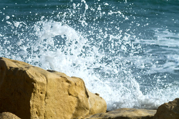 Sea rocks with wave splash
