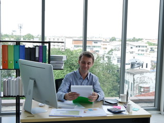 THe young  European business woman worker working in the desk with MOCKUP document data and computer in the office