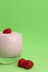 delicious raspberry yogurt in color background