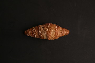 delicious spelled croissant in color background