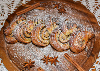 Homemade Cinnamon Roll served on the wooden board