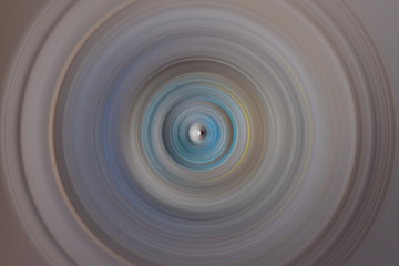 Abstract round background. Circles from the center point. Image of diverging circles. Rotation that creates circles.