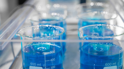 Testing Blue Solution In Science Laboratory