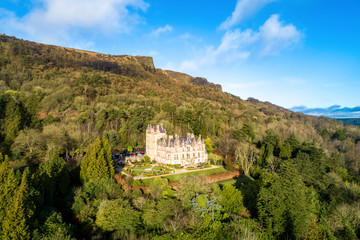 Cave Hill Country Park and Belfast castle, built in 19th century. Tourist attraction  in Belfast, Northern Ireland. Aerial view - obrazy, fototapety, plakaty