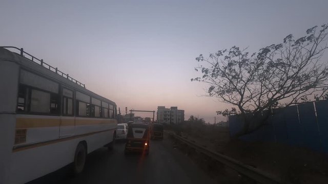 Point of view shot of vehicle stopping at railway crossing in India