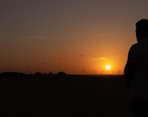 Silhouette at sunset in the dunes