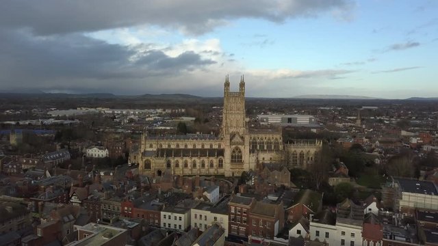 Aerial footage of Gloucester Cathedral on a cloudy day.