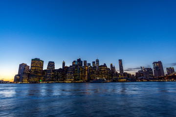 Skyline of manhattan and the east river during the blue hour in new york