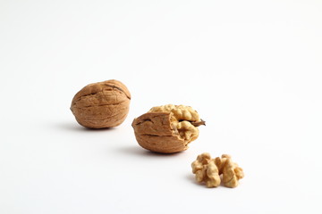 Walnut on the white background. Close up shot of whole walnut isolated on white background. Group of walnut whole on a white background.