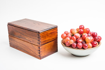 A Bowl Of Fresh Grapes With Japanese Wood Bento Box