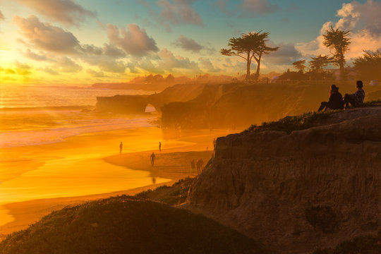 Colorful sunset over Natural Bridges beach in Santa Cruz California