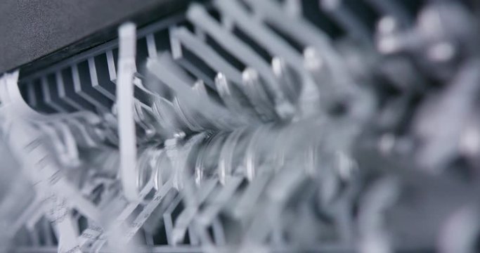 Macro shot of document shredded in mechanical shredder device