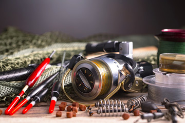 fishing tackle on a wooden table. toned image © vizafoto