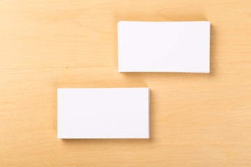 Photo of blank business cards on a general background. Template for identifier. View from above. mock up