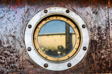 .Metal window porthole on the ship.