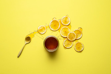 Lemon slices and honey jar. Healthy eating. Natural cold remedy