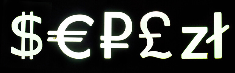 Obraz premium Dollar, euro, pound and zloty symbol glowing on black background. Neon night currency exchange sign.