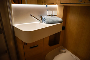 Interior of luxury caravan. Detail photo of coach with equipment.Kitchen