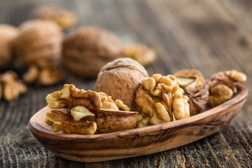 Handful of Walnuts on wooden background