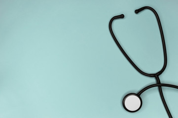 Stethoscope attributes medical,health care ,cardiac care on above turquoise background copy space top view