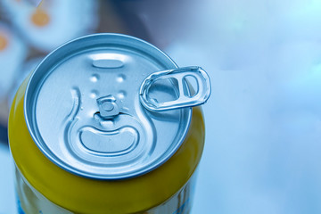 Obraz premium Aluminum can. closeup of a broken key. Defect, substandard, defective in production. Dissatisfaction, deception, disappointment, alcohol addiction.