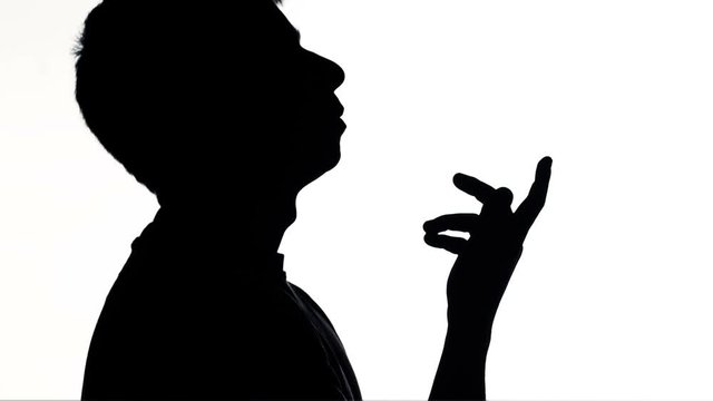 silhouette of young man thinking and reasoning , male seeking a solution of problem, concept of people feelings and life