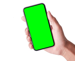 Man's hand shows mobile smartphone with green screen in vertical position isolated on  background. Mock up mobile