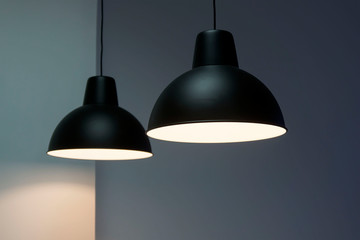 Black decorative lamp hanging from the ceiling.modern lamp isolated on white background