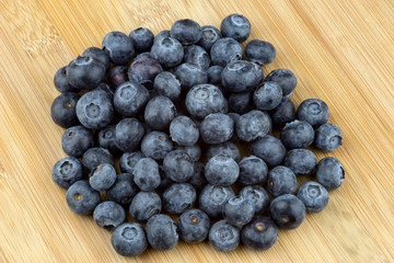 Fresh Blueberries On A Wooden Table Top