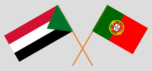 Crossed flags of Sudan and Portugal