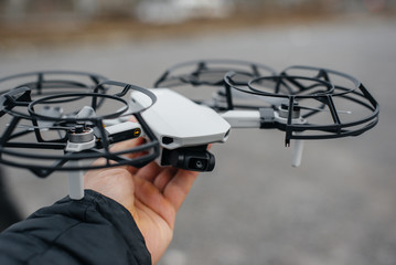 Young people are preparing a drone for flight. Drone setup.