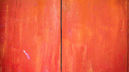 Fototapeta premium Old red painted board background. Wood panels on a rustic barn