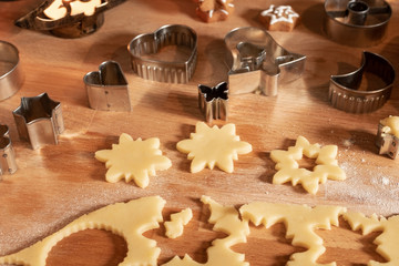 Cutting out star shapes for traditional Linzer Christmas cookies