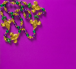 Mardi gras carnival decoration beads purple background