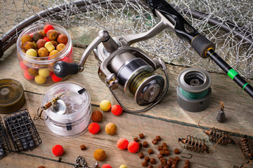 fishing tackle on a wooden table.