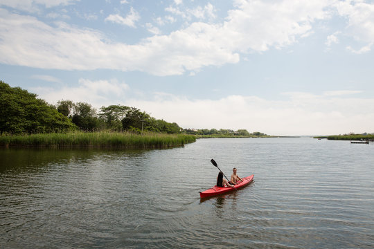 20s 30s millennials kayaking on river in the north