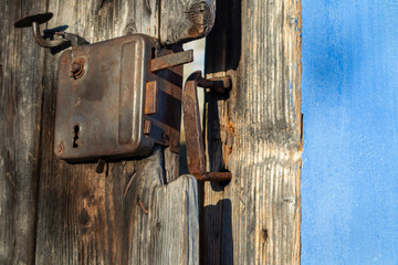Vintage door latch. Detail of Old traditional Romanian blue house. Old door in Sibiu, Romania