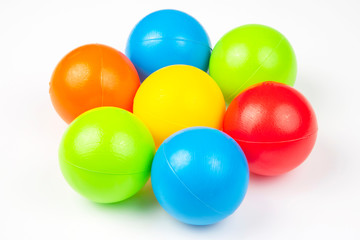 Colored plastic balls on white background. leisure and game items. round objects