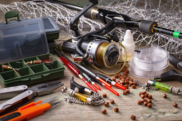 fishing tackle on a wooden table.