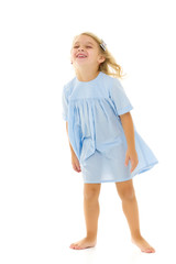 Little girl in an elegant dress.The concept of a happy childhood