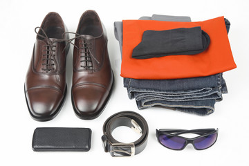 Fototapeta premium Classic men's shoes, belt, glasses, clothes and mobile phone on white background