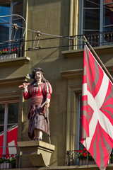 The statue of the butcher decorates frontage of a building in the old town of Bern, Switzerland
