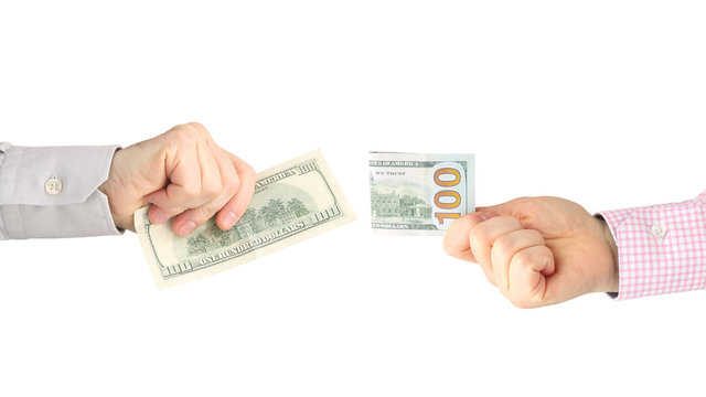 male hands with money opposite each other on a white background. business relationship. salary.