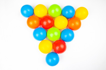 Colored plastic balls on white background. leisure and game items. round objects