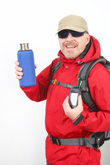 tourist traveler in a red jacket shows a metal bottle for water on a white background