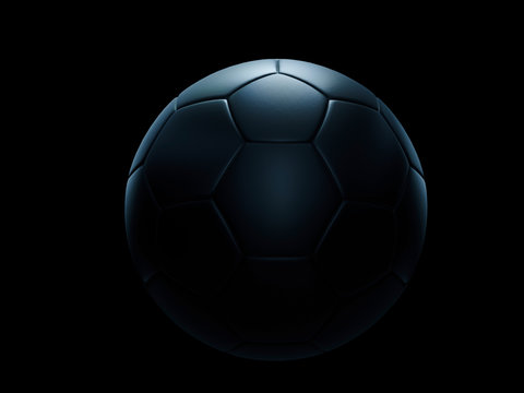 Black football ball against black background.