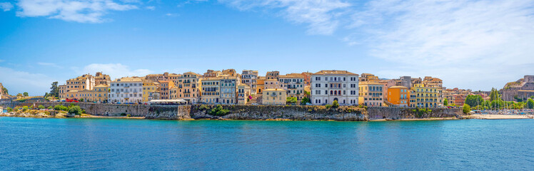 Panorama of Corfu town from the sea. Old town buildings of Kerkyra island - obrazy, fototapety, plakaty