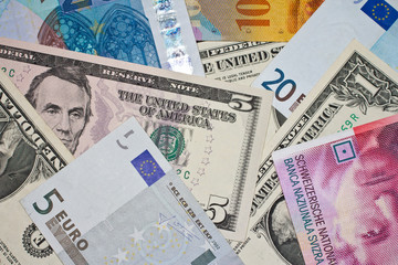 Fototapeta na wymiar Various Euro, US dollar and Swiss franc banknotes